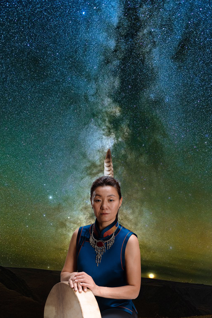 Portrait of shaman Bulgan Windhorse with a frame drum under a starry sky